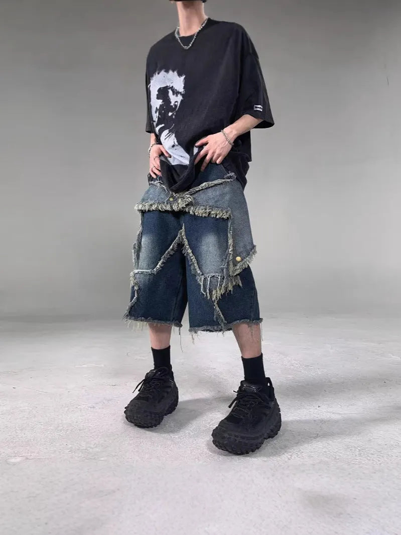 Blue cotton denim shorts for men with frayed hem detailing and five-pointed star patch, loose fit retro style